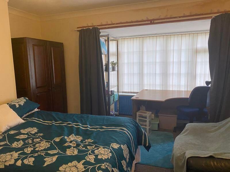 Property photo 3 of 15 A Cozy Bedroom Featuring A Double Bed With Floral ...