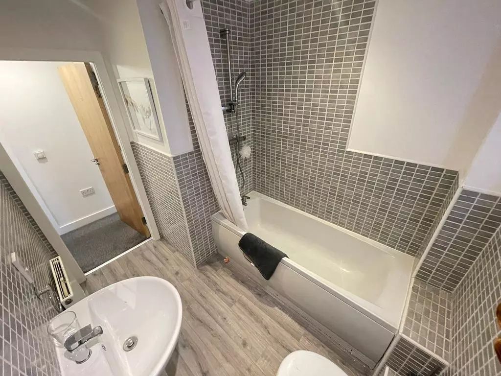 Property photo 3 of 4 This Stylish Bathroom Suite Features Modern Tiles ...