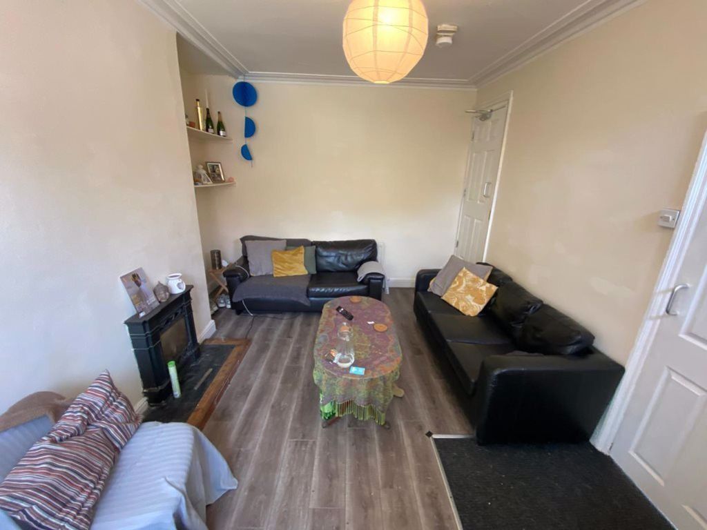 Property photo 2 of 16 A Spacious, Well-Lit Living Room Featuring Modern ...