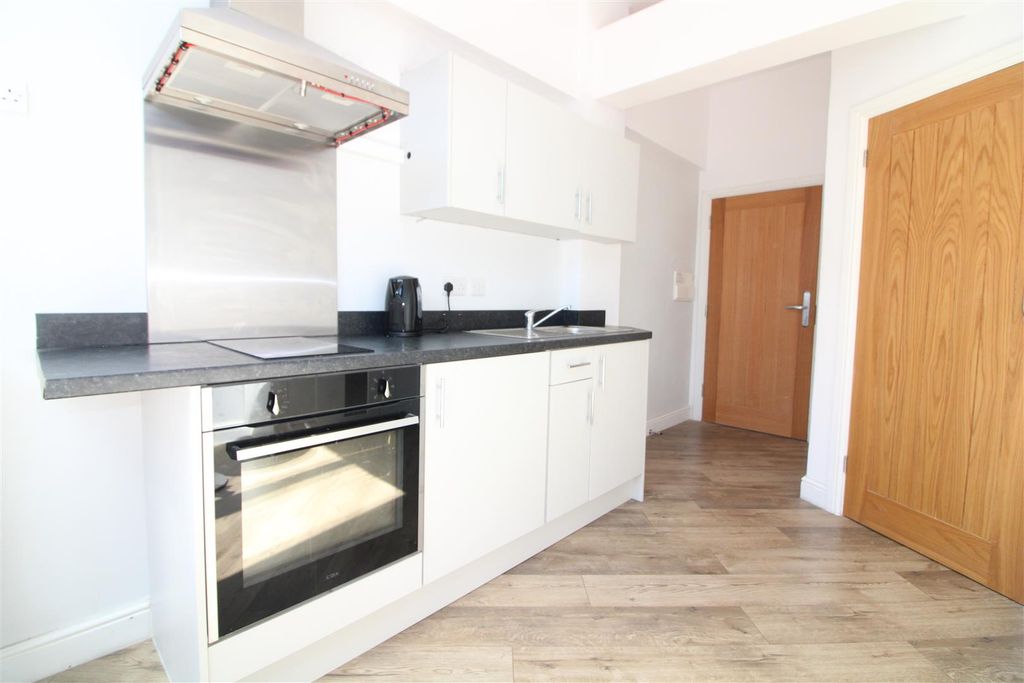 Property photo 3 of 8 Kitchen Area