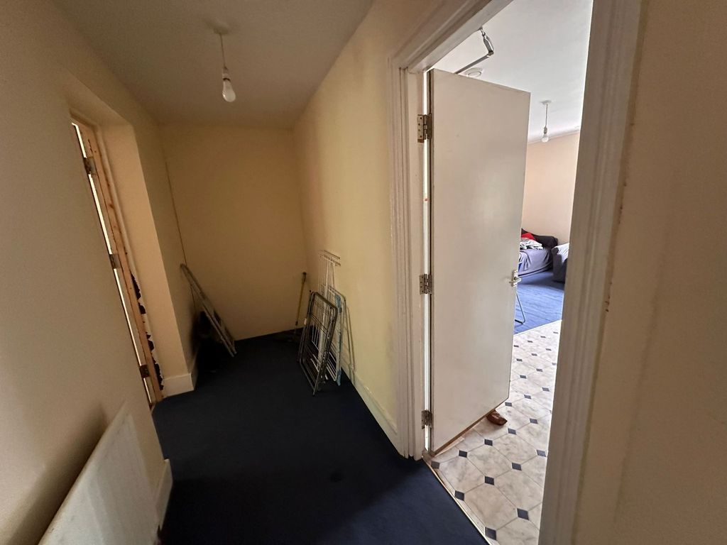 Property photo 2 of 18 A Simple Hallway With Soft Cream Walls And Dark Ca...