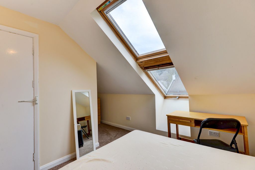 Property photo 2 of 27 A Bright And Welcoming Bedroom With A Large Skylig...