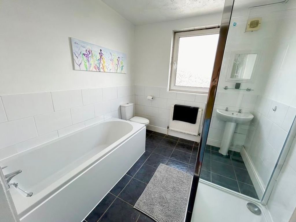 Property photo 3 of 5 A Spacious And Bright Bathroom Featuring A Modern ...
