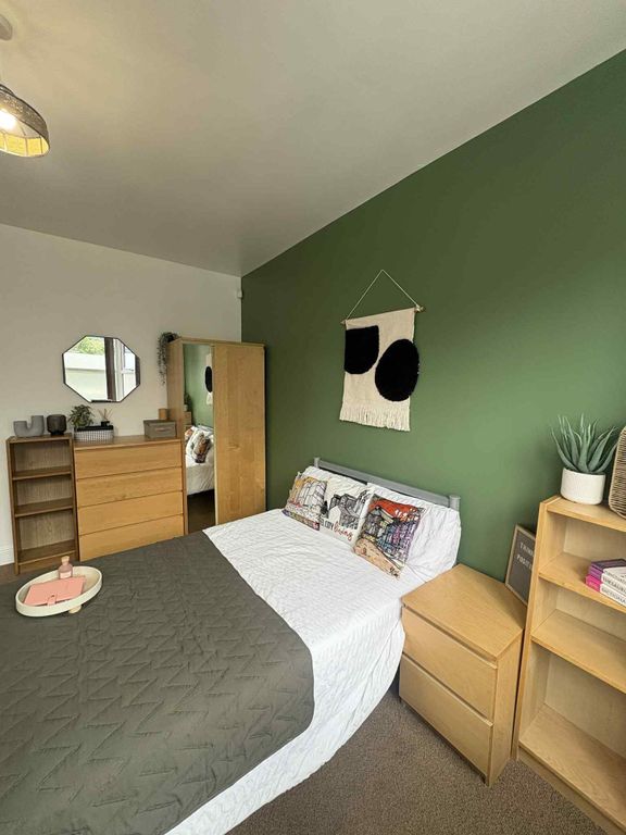 Property photo 1 of 15 A Stylish Double Bedroom Featuring A Cozy Bed With...
