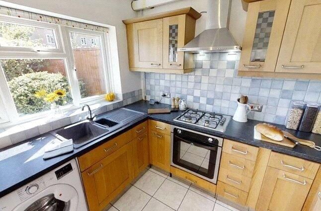 Property photo 3 of 4 A Bright And Tidy Kitchen Featuring Ample Natural ...