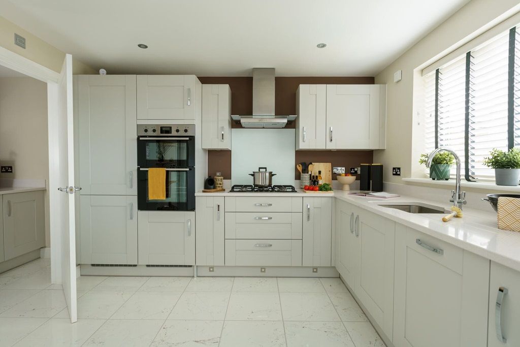 Property photo 2 of 16 The L-Shaped Modern Kitchen Offers Ample Storage Space