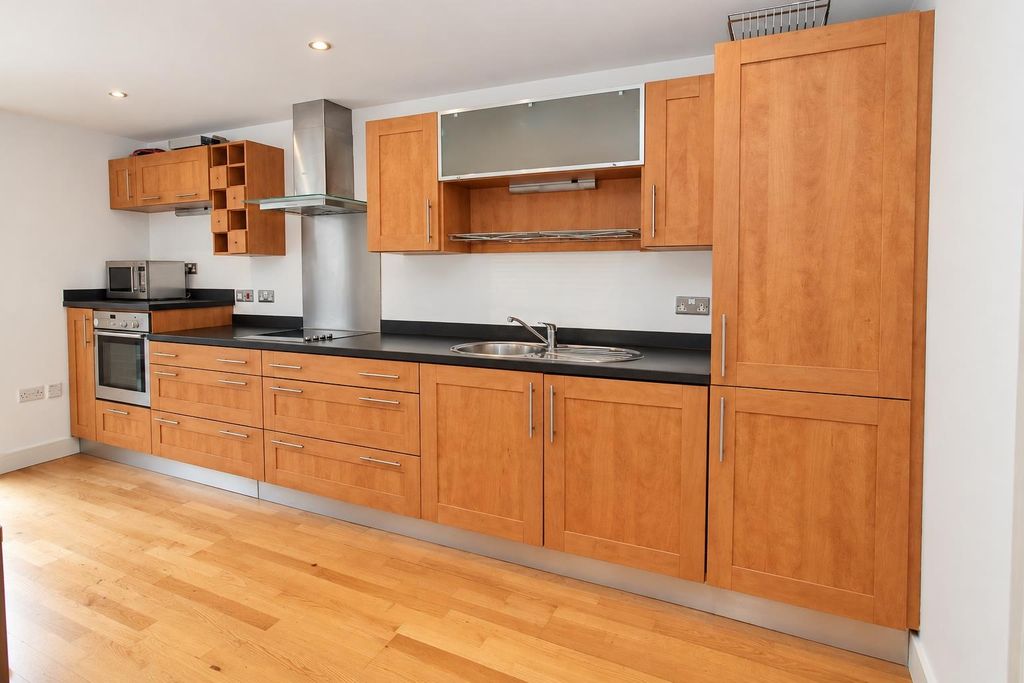Property photo 2 of 6 Modern Wooden Kitchen With Ample Storage Space...