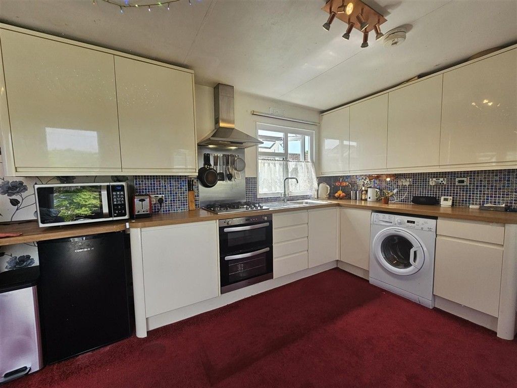 Property photo 1 of 11 Kitchen Area