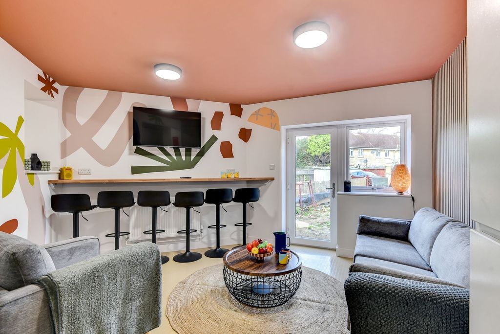 Property photo 3 of 6 This Vibrant Communal Lounge Features Modern Decor...
