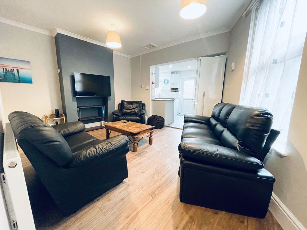 Property photo 2 of 16 Bright, Modern Living Room With Comfortable Black ...