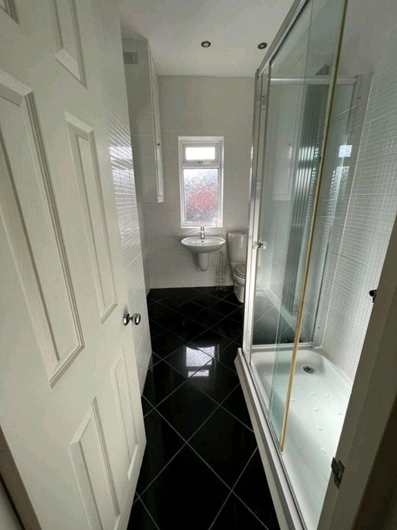 Property photo 2 of 7 Modern White Bathroom With Glossy Black Tiles...