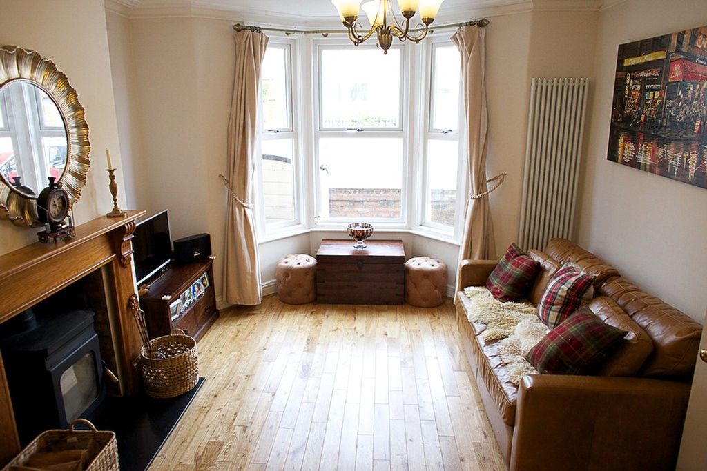 Property photo 1 of 12 This Spacious Living Room Features Large Bay Windo...