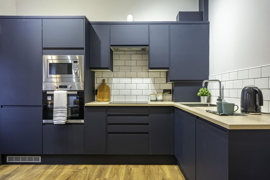Property photo 2 of 8 Modern Navy Blue Kitchen With Sleek Appliances...