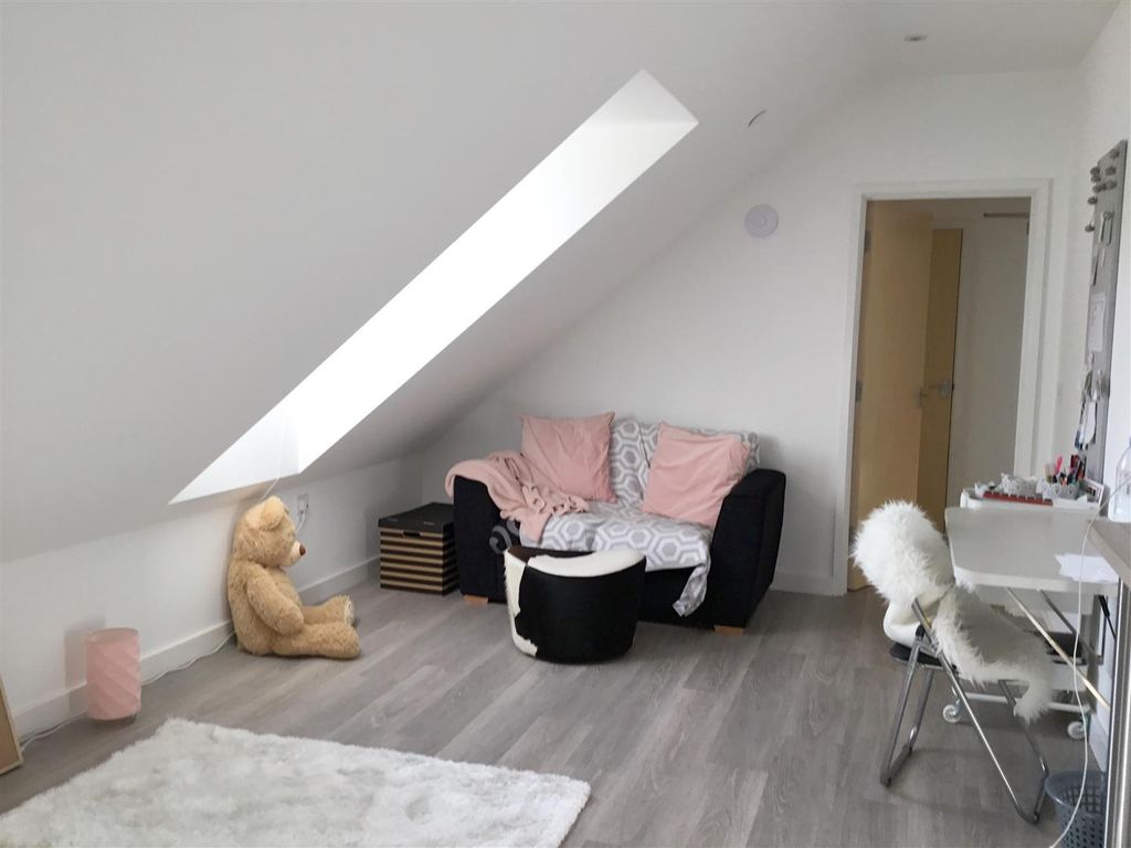 Property photo 2 of 8 Bright Attic Lounge With Skylight And Cozy Sofa...