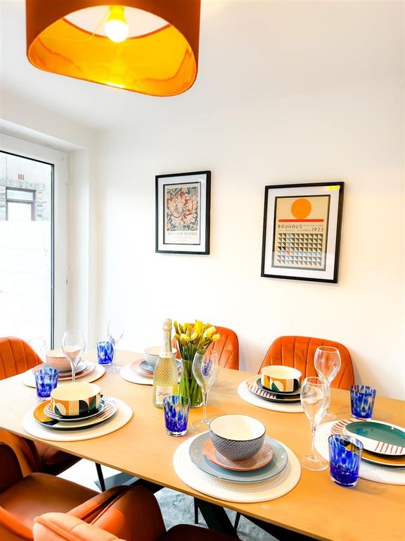 Property photo 1 of 22 Vibrant Dining Area With Modern Orange Accents...