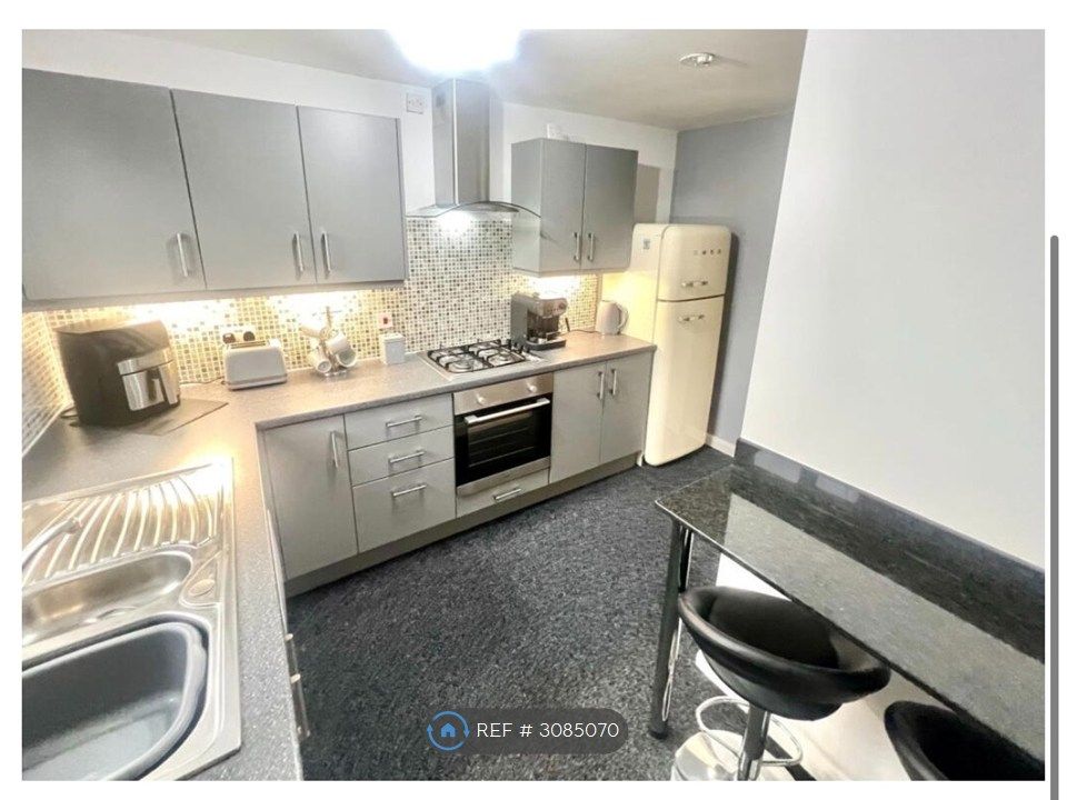 Property photo 2 of 9 Kitchen With Breakfast Bar
