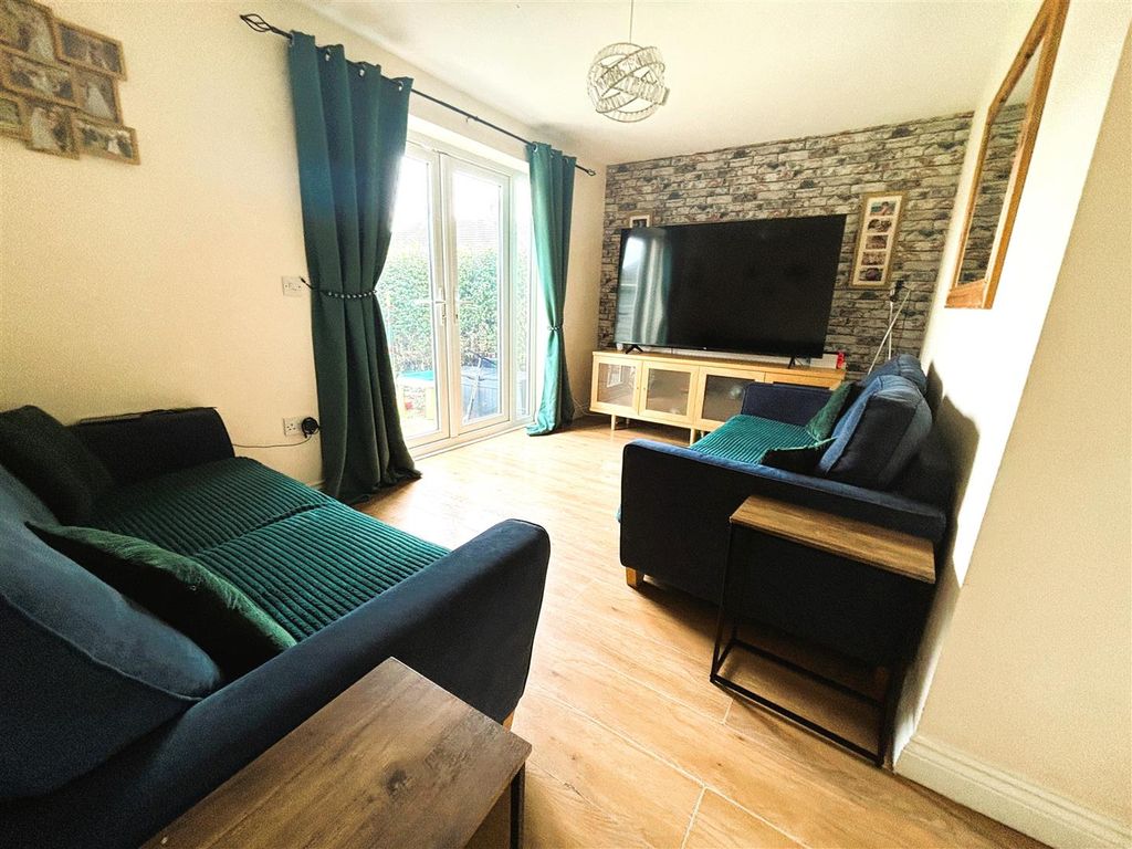 Property photo 2 of 13 Rear Living Room