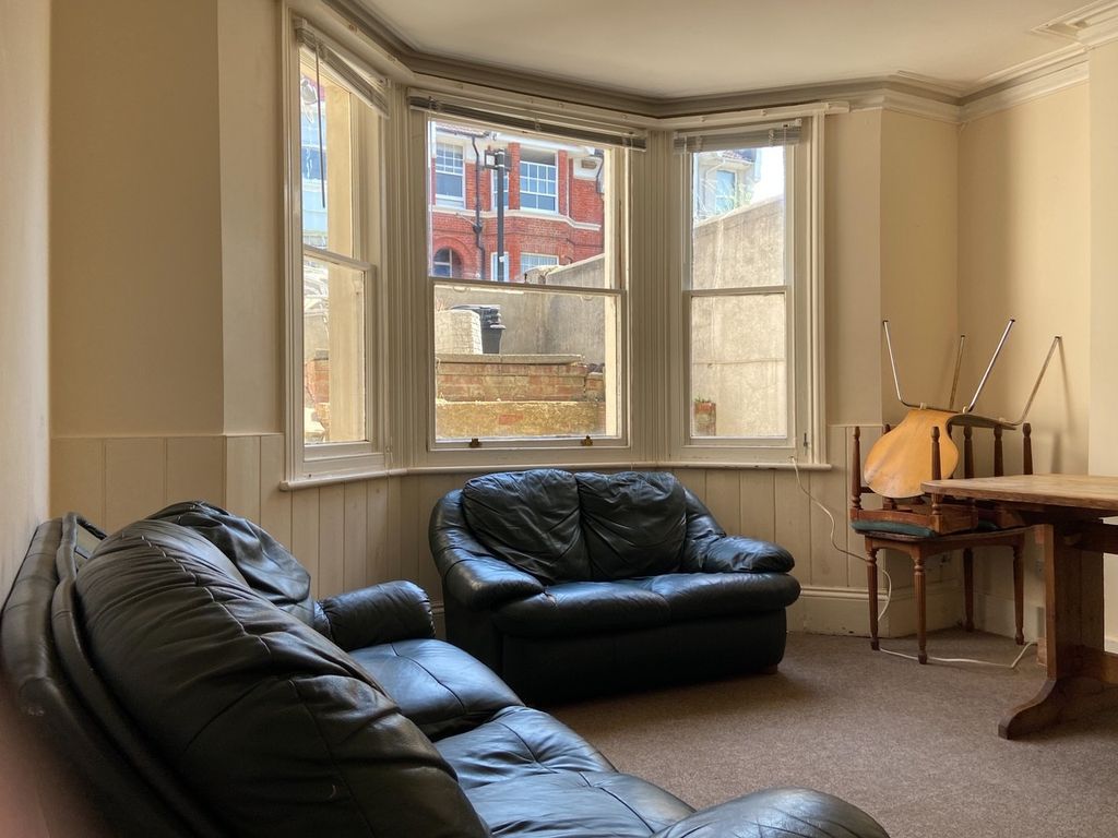 Property photo 1 of 19 A Bright And Inviting Living Room With Comfortable...