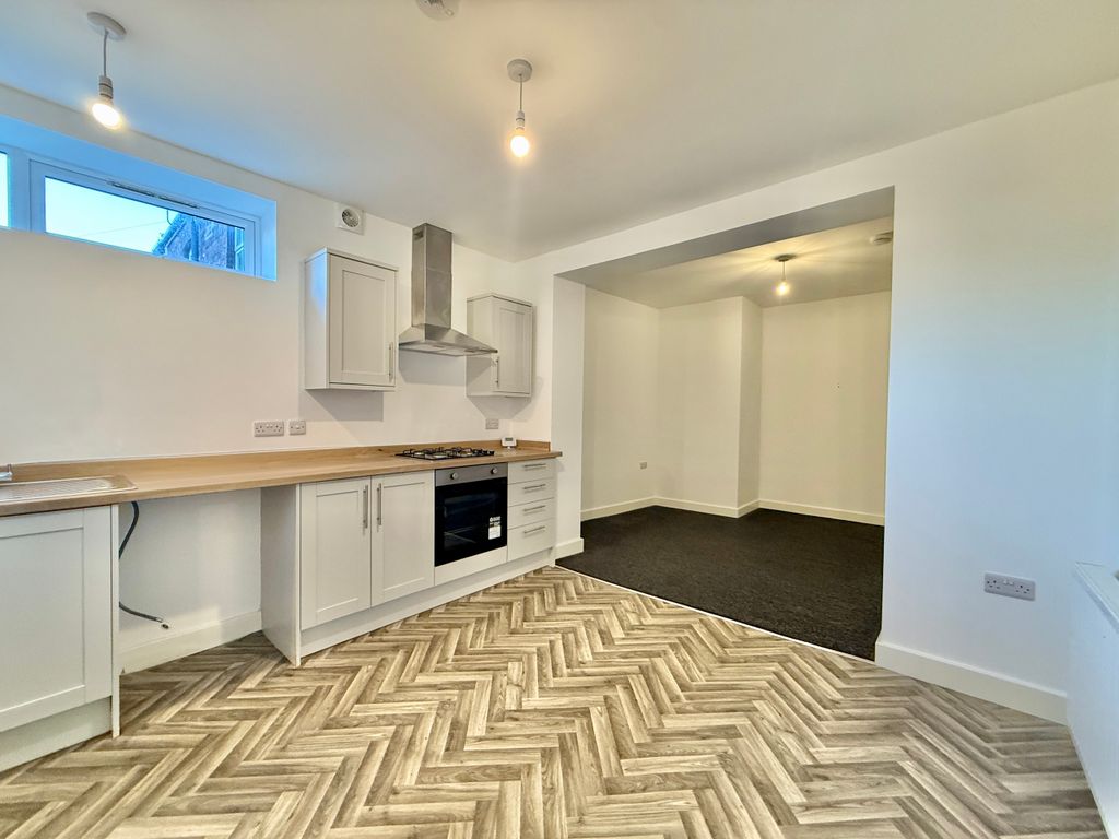 Property photo 3 of 6 Kitchen Living