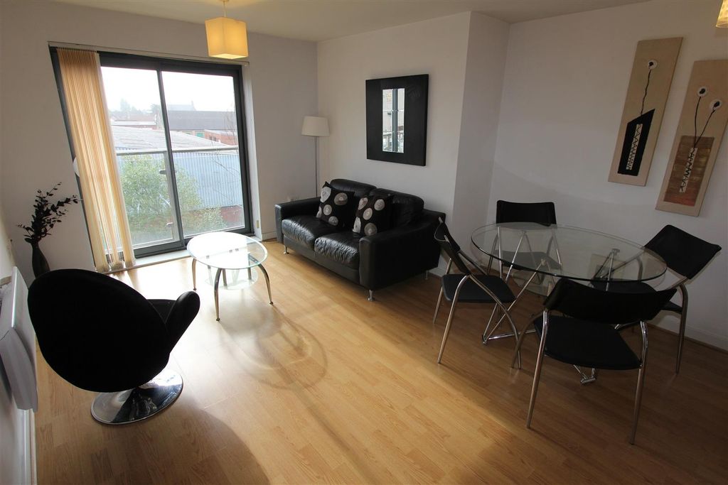 Property photo 2 of 8 Bright Lounge With Dining Area And Balcony Access...