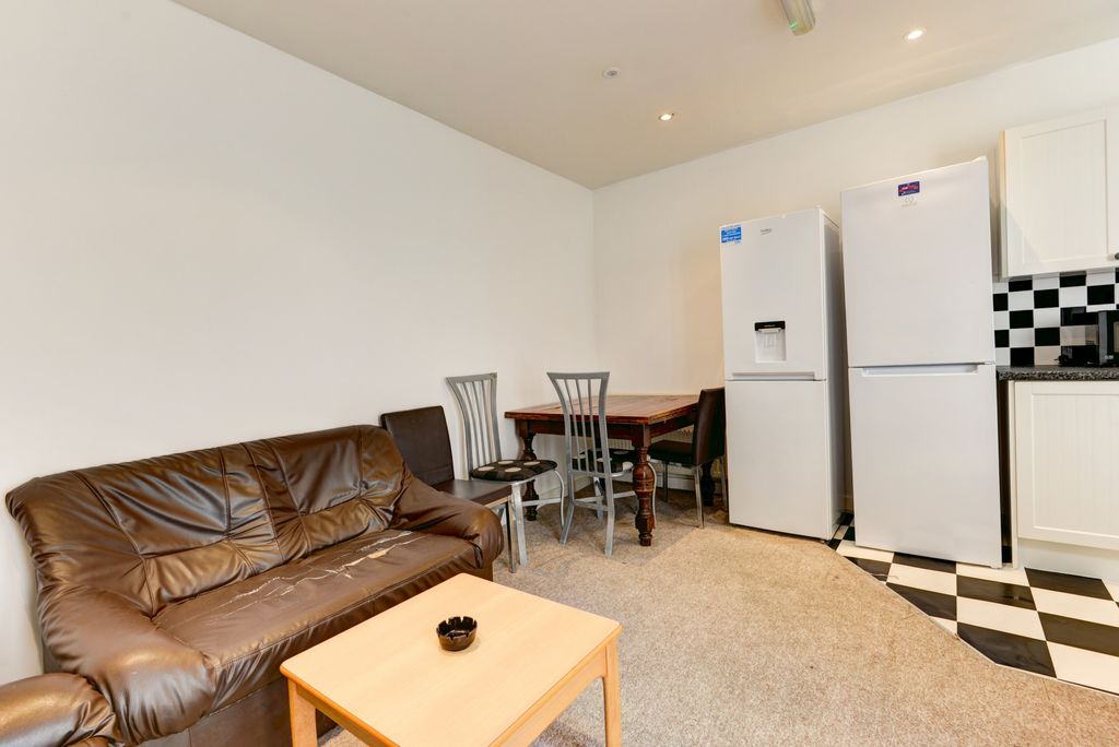 Property photo 1 of 13 A Cozy Living Room Featuring A Comfortable Brown l...