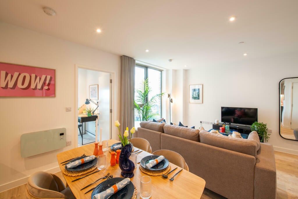 Property photo 3 of 17 Bright And Stylish Living Room Featuring A Spaciou...