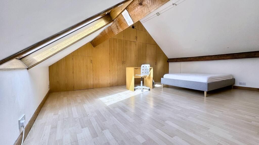 Property photo 2 of 15 Bright, Renovated Attic Bedroom With Sloped Ceilin...