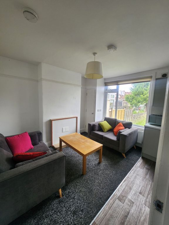 Property photo 3 of 17 A Cozy Living Room Featuring Two Comfortable Grey ...