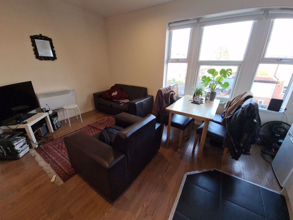 Property photo 3 of 25 A Bright And Inviting Living Room With Large Windo...