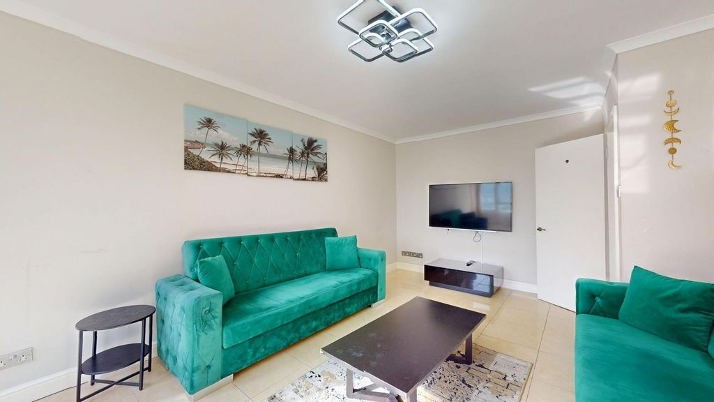 Property photo 2 of 13 Bright And Inviting Living Room Featuring Vibrant ...