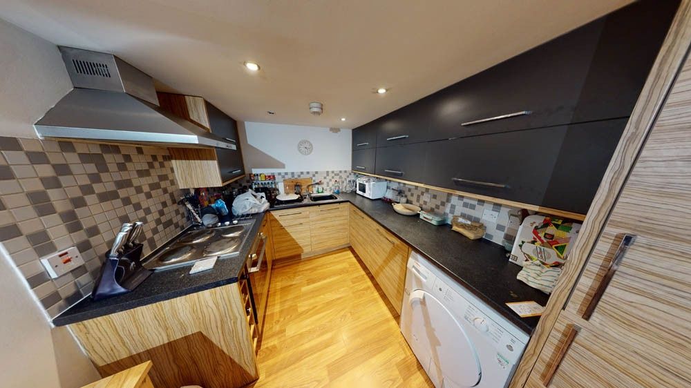 Property photo 3 of 6 A Modern, Well-Lit Kitchen With Contemporary Cabin...