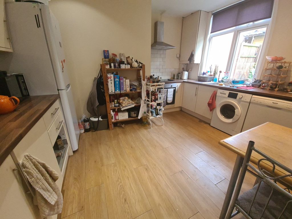 Property photo 3 of 9 Bright And Modern Kitchen Featuring Ample Countert...