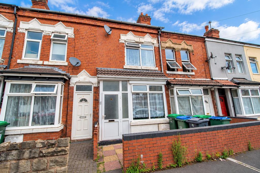 Property photo 1 of 9 Victorian Terraces Under A Cloudy Sky.Png
