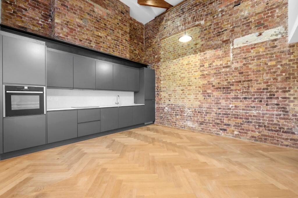 Property photo 3 of 18 3. Kitchen With Brick Wall.Jpeg