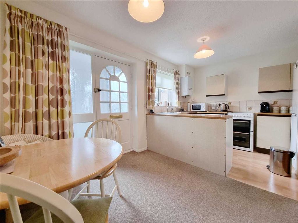 Property photo 2 of 12 Dining Kitchen: