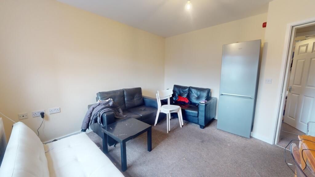 Property photo 3 of 6 A Cozy Living Room Featuring Comfortable Seating W...