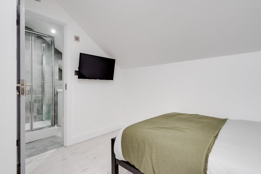 Property photo 3 of 14 A Well-Lit, Modern Master Bedroom Featuring A Larg...