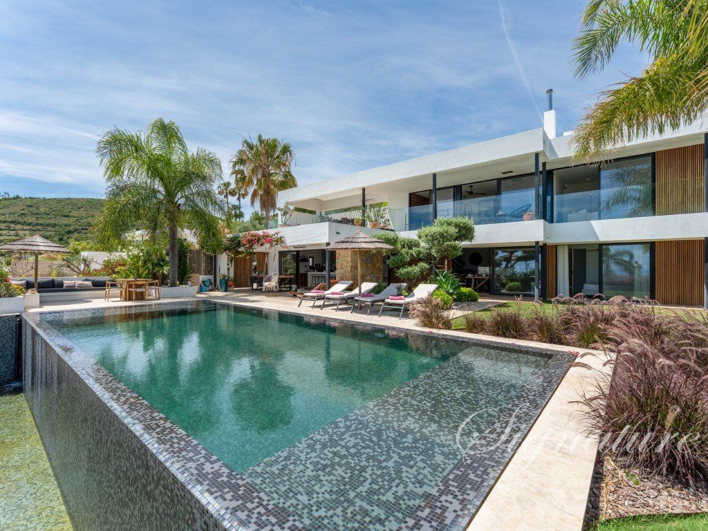 Property photo 1 of 57 A Stunning Five-Bedroom Villa Showcasing Contemporary Architecture, Ideally Located In The Heart Of Santa Bárbara De Nexe And Enjoying Breathtaking Panoramic Sea Views.
