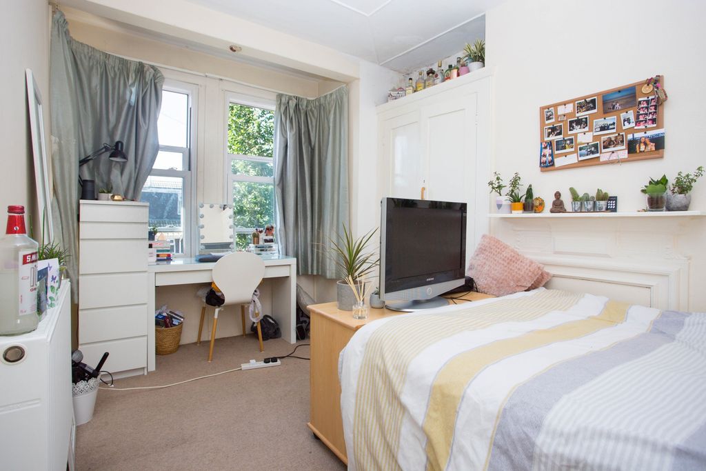 Property photo 2 of 12 Bright, Neatly Arranged Bedroom With A Comfortable...