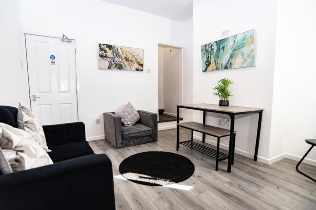 Property photo 2 of 12 This Modern Living Room Features A Cozy Seating Ar...