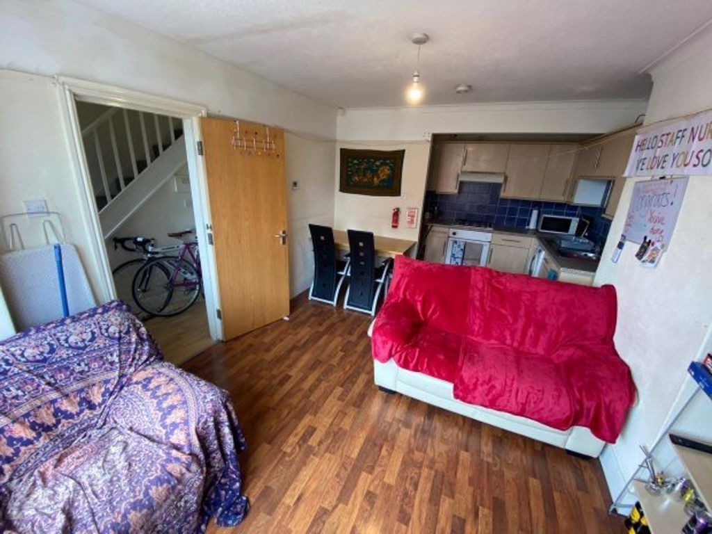 Property photo 2 of 7 Bright And Inviting Living Room Featuring Comforta...