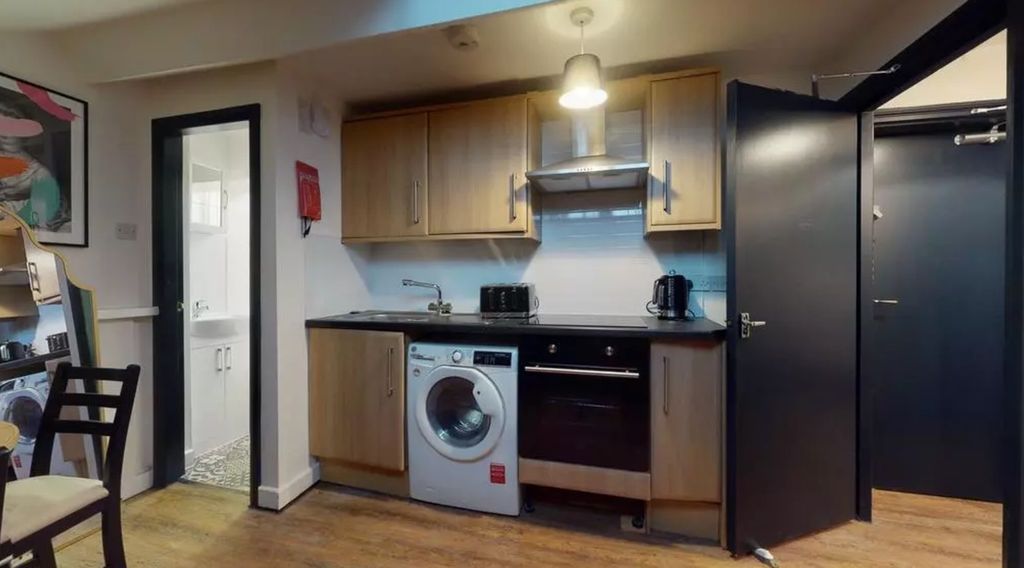 Property photo 3 of 5 A Bright And Modern Kitchenette Equipped With Esse...