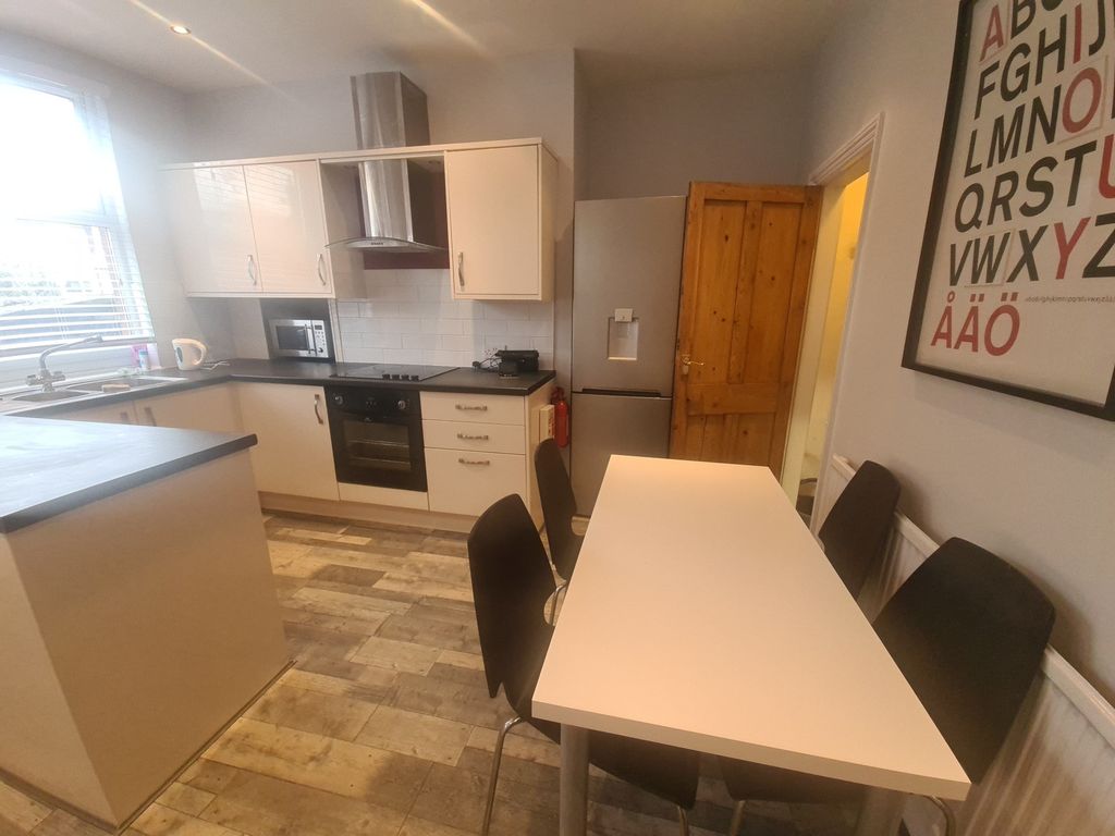 Property photo 1 of 11 A Bright And Modern Kitchen Featuring Ample Natura...