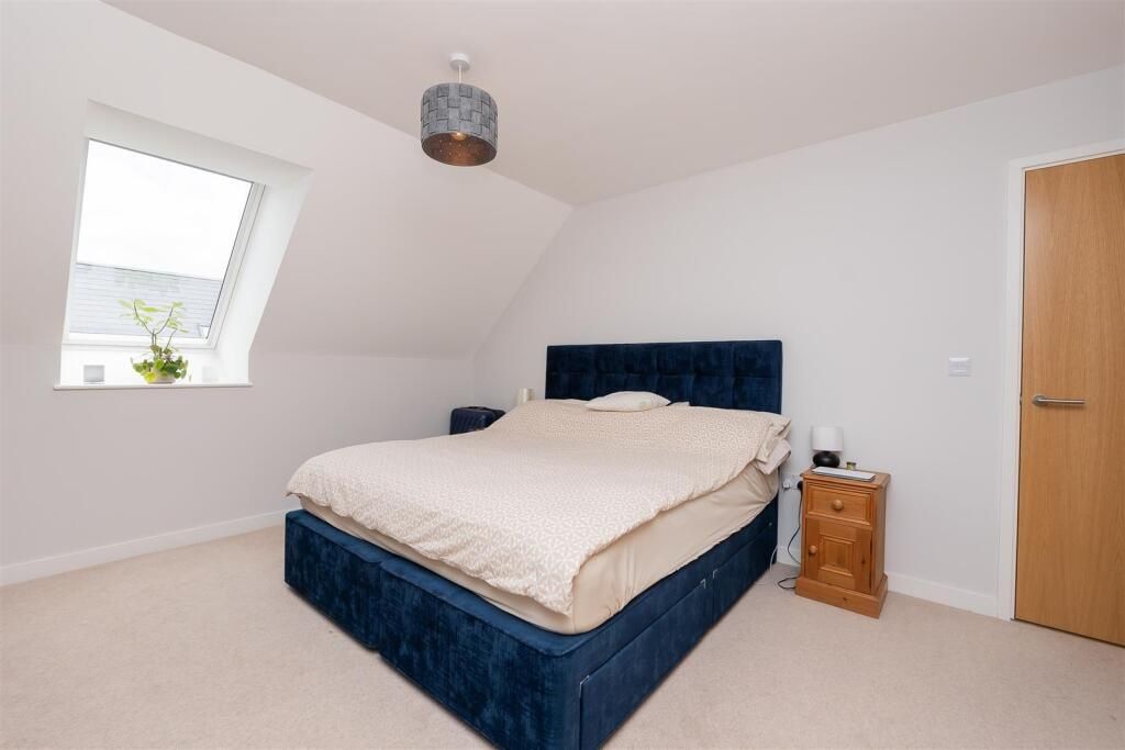 Property photo 2 of 15 Bright And Inviting Master Bedroom Featuring A Com...
