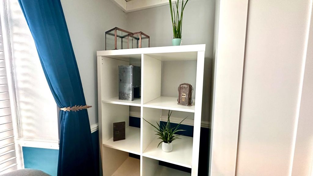 Property photo 2 of 5 Elegant Shelving Unit With Stylish Decor Accents....