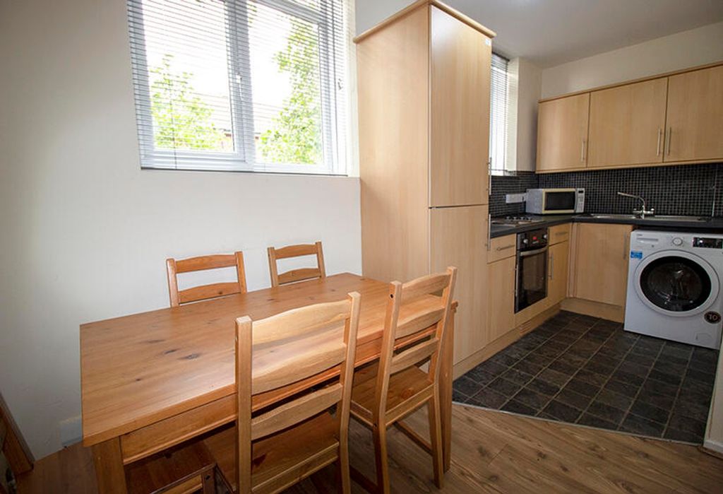 Property photo 2 of 3 This Well-Appointed Kitchen Features Modern Applia...