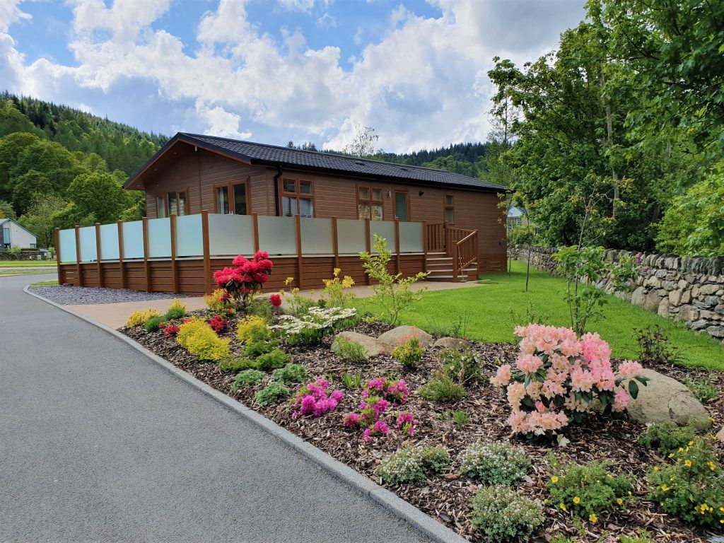 Property photo 1 of 4 Omar Classic Holiday Lodge With Decking And Landscaped Gardens In Conwy