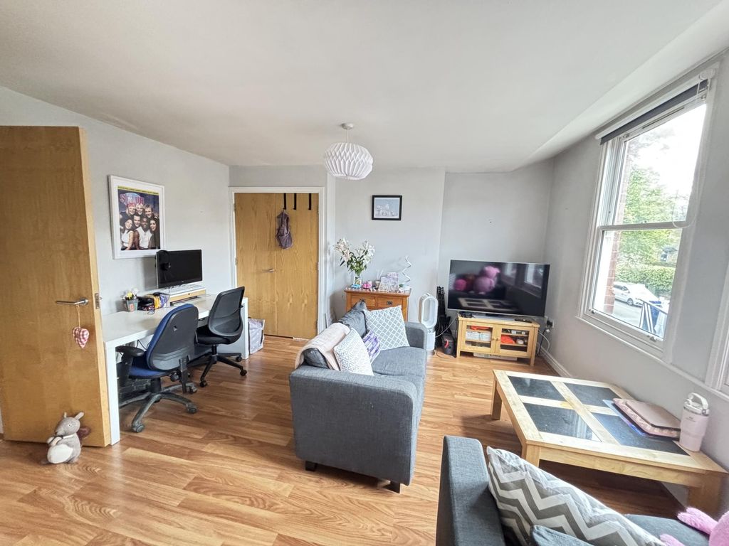 Property photo 1 of 15 Bright And Welcoming Living Room Featuring Ample N...