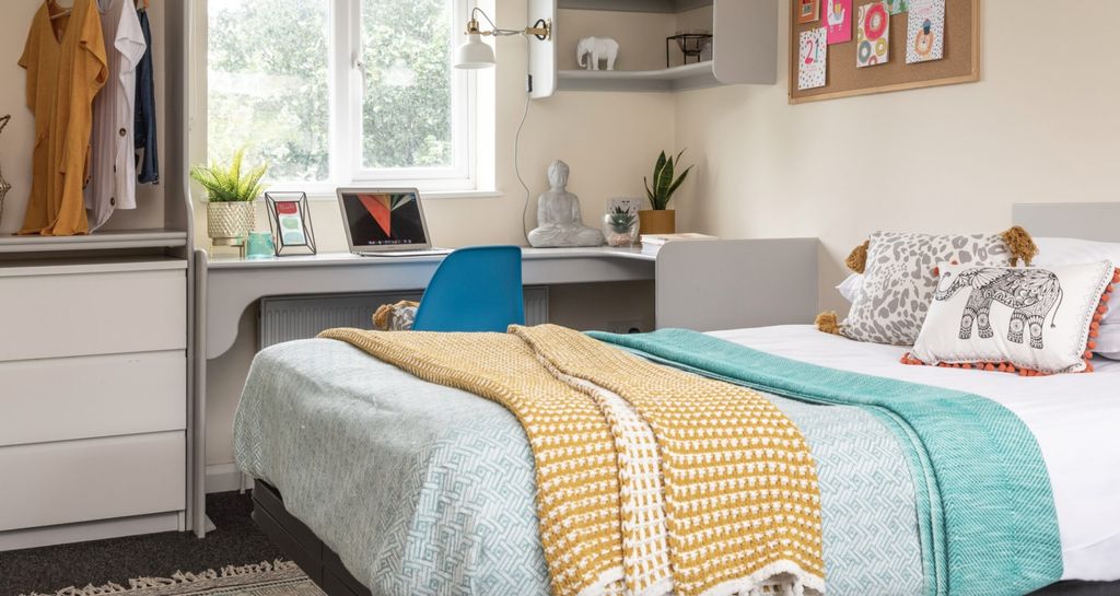 Property photo 3 of 7 This Inviting Double Bedroom Features A Cozy Atmos...