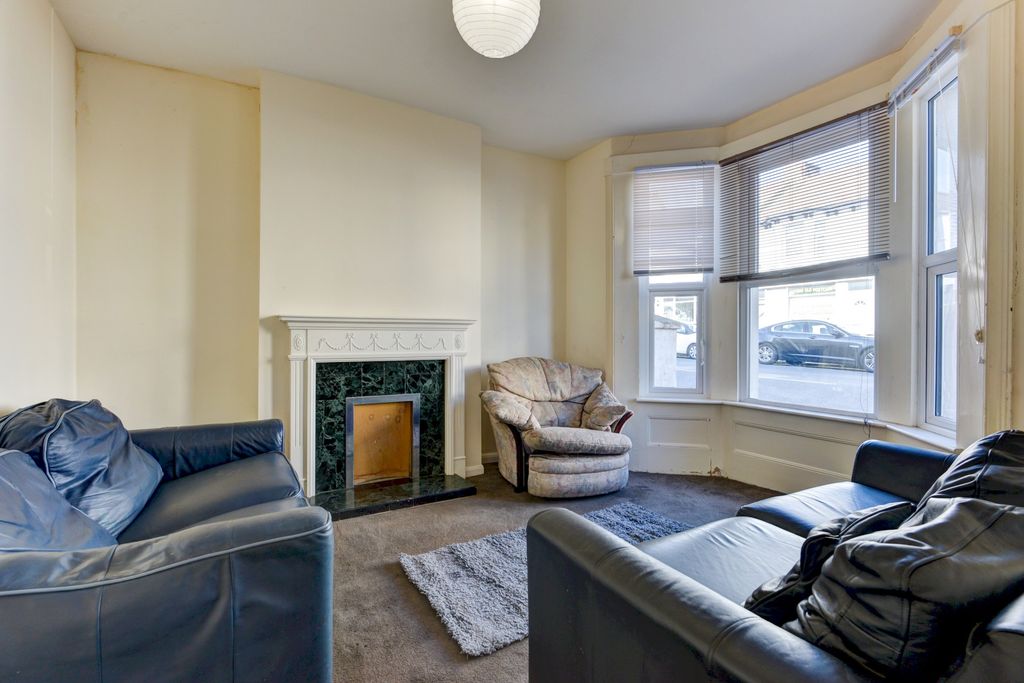 Property photo 2 of 21 A Bright And Welcoming Living Room Featuring Large...